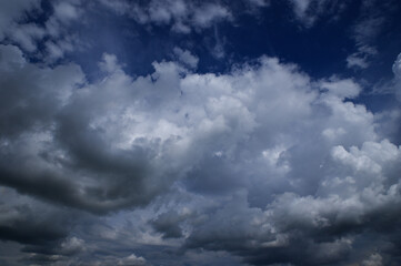 Cumulus clouds soaring high in the blue sky