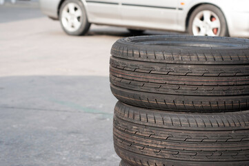 New tyres change swap with old tires outdoor service with blur old car vehicle.