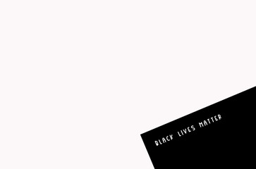Black Lives Matter white color text in the corner, social slogan on poster on black background, isolated part of the image