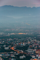 CHIANG MAI, THAILAND - May 27,2020:  Aerial view Chiang Mai City skyline and lights city in twilight night background from the aerial view point on top of mountain