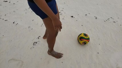 Black African American Latino woman plays beach soccer on white sand - Powered by Adobe