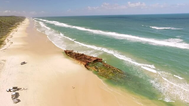 An old shipwreck is seen washed up on a beach of Fraser Island, off the coast of Queensland, Australia.