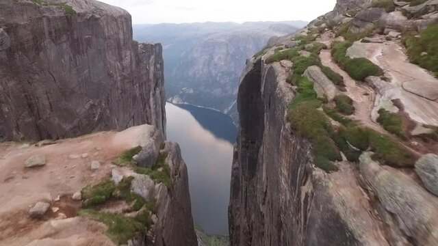 An aerial view shows a couple standing on Kjeragbolten, a boulder on the Kjerag mountain in Rogaland, Norway.