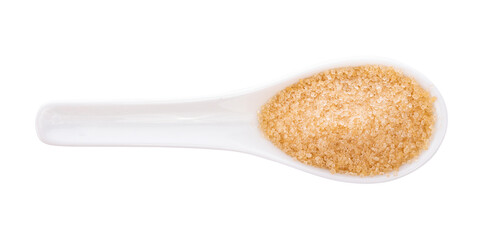 Brown sugar in spoon on white background