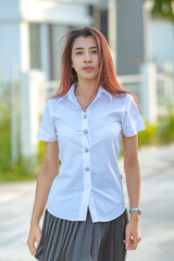 Portrait of asian or thai student university uniform beautiful girl relax and smile