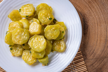 Cooked gherkin dish. On a wooden table. Typical Brazilian dish