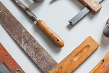Close up of old traditional tool small wooden file angle wood craft culture patina carpenter tool...