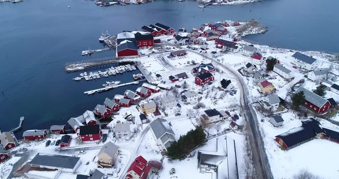 An aerial view shows dwellings and docks on the wintry Lofoten Islands, Norway.