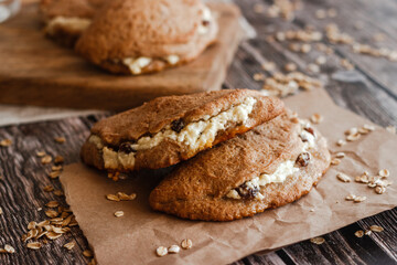 Tasty cakes with cottage cheese and raisins. Patties on a wooden table. Country style