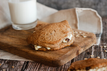 Tasty cakes with cottage cheese and raisins. Patties on a wooden table. Country style