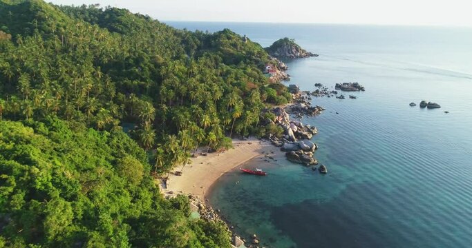 An aerial view shows tourists enjoying swimming and swings on the beach of Ko Tao, Thailand.