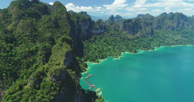 An aerial view shows green mountains and harbor lodgings at Khao Sok National Park in Surat Thani, Thailand.