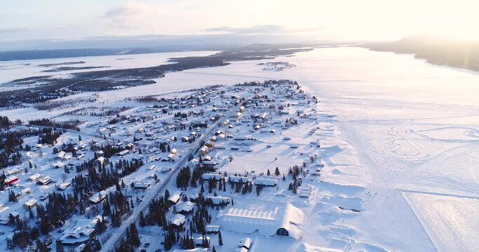 An aerial view shows the colorful homes near a forest in the wintry town of Kiruna, Sweden.