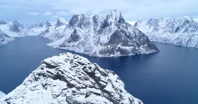 Snow-covered mountains are seen in the Lofoten Islands, Norway.