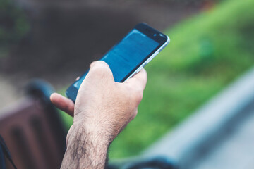 man holding a phone in his hands