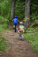 kids riding bikes in the woods