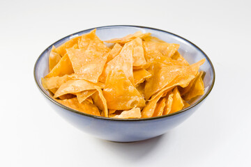 Beer snack in the blue bowl on the white background