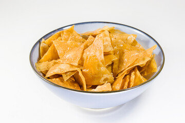 Beer snack in the blue bowl on the white background