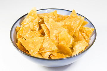 Beer snack in the blue bowl on the white background