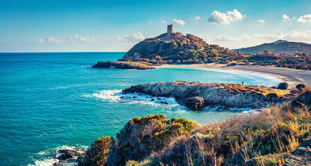 Majestic summer view of popular tourist destination - Acropoli di Bithia with Torre di Chia tower on background. Beautiful morning view of Sardinia island, Italy, Europe. Traveling concept background