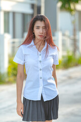 Portrait of asian or thai student university uniform beautiful girl relax and smile