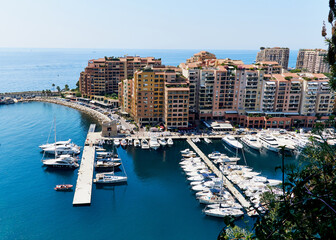 Fototapeta na wymiar Sailboats in Monaco against the blue bay and city