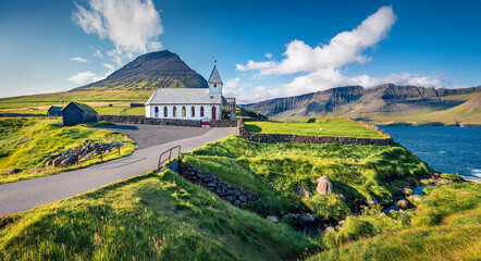 Attractive summer view of Vidareidi Kirkja. Colorful outdoor scene of Vidareidi village, Vidoy...