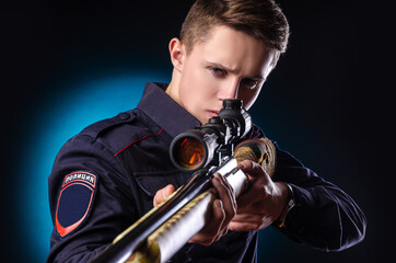 a guy in a police uniform with a sniper rifle. english translation 