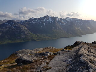 sunset in the mountain fjord valley in northern Norway