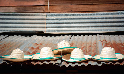Sun hats for farmers were sun dried on zinc roofs. Before selling.