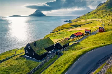 Door stickers Atlantic Ocean Road View from flying drone. Captivating summer view of Velbastadur village with typical turf-top houses. Incredible evening scene of Streymoy island, Faroe, Denmark, Europe.