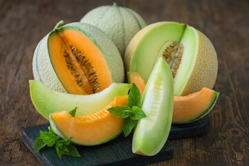 Juicy ripe melons on the wooden table