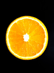 Orange on the black background. Fresh fruit vitamins.