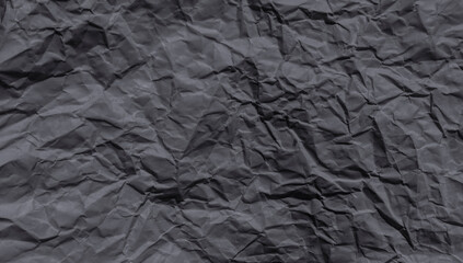  Sheet of black crumpled  paper useful as a background.