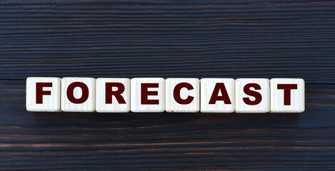 concept word FORECAST on cubes on a beautiful dark wooden background