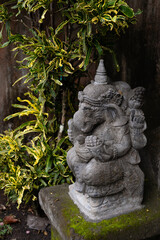 balinese statue of god on blurry background