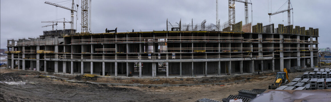 Massive Housing Construction Project With A Lots Of Construction Cranes And Workers Involve.