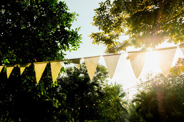White triangular flags are commonly used to decorate the garden during special occasions or festivals.