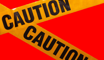 Yellow caution tapes crossing. Isolated. Red background. Protection against viruses, bacteria, and...