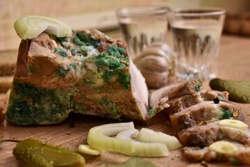 two glasses of vodka and an appetizer