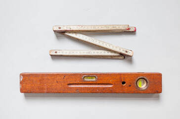 Old ruler and precious wood spirit level testing device expertise accuracy customization manual training home improvement woodworking carpentry tradition precision work diy