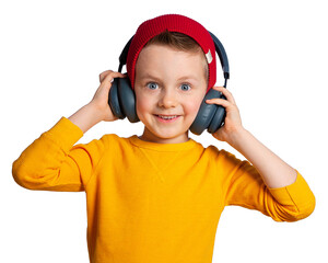 A child with headphones. A beautiful European boy with blue eyes listens to music in headphones,...