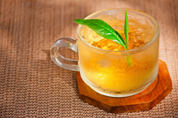 Cold green tea with Green tea leaves , Ideal for use in the design put images and insert text