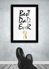 Best dad ever frame on wall with relaxed feet in foreground, father day concept