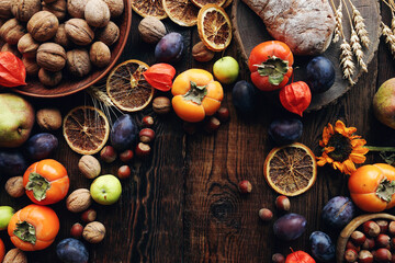 Autumn still-life composition with fresh fruits and vegetables on rustic wooden table