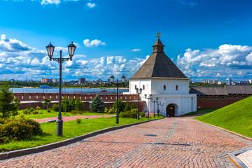 The Kazan Kremlin, Tatarstan, Russia. Cobblestone road to the Kremlin tower of white stone and a...