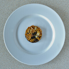 Aerial top down view of a florentine on small a round white plate