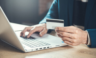 man hand credit card and computer