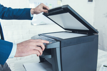 man working in xerox machine