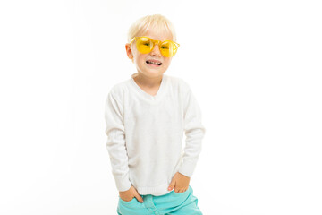 Little boy with short blonde hair, blue eyes screams, picture isolated on white background